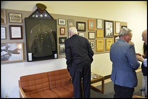 A friend of Nick’s looks at the memorabilia collection.