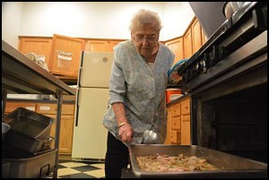 Frances Farnia prepares soup for the Queen of Apostles soup kitchen, something she has been doing every Thursday for the past several years.