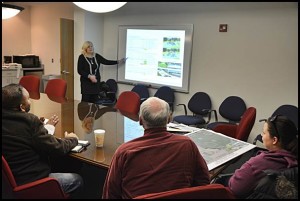 Kathy Angerer, the Director of Community & Economic Development, outlines improvement plans for the city’s three parks at a special meeting for the city council. 