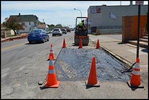 A Wayne County work crew repairs some of the worst sections of Conant, which is a county-owned road. In the meantime, city officials are still seeking the total repaving of Conant.