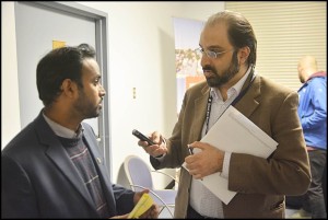 City Council candidate Nayeem Choudhury is interviewed by a reporter about an ongoing Michigan State Police investigation into election fraud.