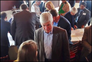 Gov. Rick Snyder and some of his top administrators visited with local officials and community members on Friday afternoon to talk about a new development initiative for the city called “Project Rising Tide.” Photo by Walter Wasacz.