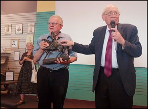 Former U.S. Senator Carl Levin presents a replica statue of Thaddeus Kosciuszko to Hamtramck Historical Museum Director Greg Kowalski at last week’s unveiling of the museum’s mural “Coming to Hamtramck.”  