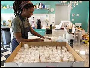 Jamila Kokumo prepares a batch of macrons at Le Detroit Macron Bakery, located on Evaline just west of Jos. Campau. The bakery is celebrating its one-year anniversary this Sunday (Sept. 23).